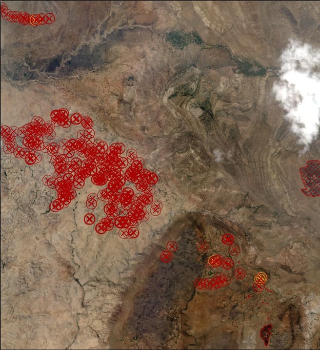 A satellite image of Gijet in the Tigray region with marked red crosses relates to the number of structures significantly damaged