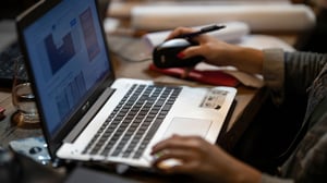 a woman working on a laptop